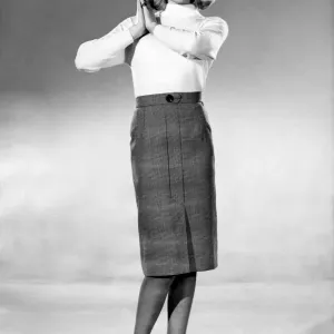 Reveille Fashions 1964 Print: Maureen Walker in Jumper and Pencil Skirt