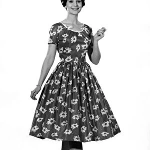 Reveille fashions: Ann Cave modelling a flower print summer dress. July 1961 P008773