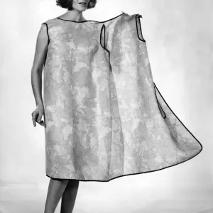 Reveille Fashions: Helen Norman modeling the latest in house coats for the house wife Reveille Fashions: Helen Norman modeling the latest in house coats for the house wife
