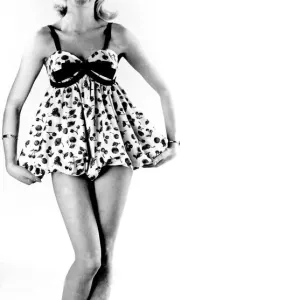 Reveille Fashions. Mannequin modelling a short length night dress. March 1959 P006933