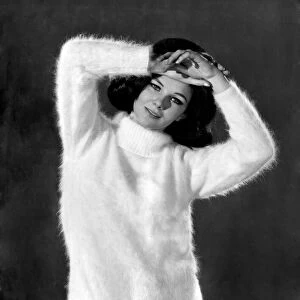 Reveille Fashions. Meriel Weston wearing white jumper. October 1964 P007535