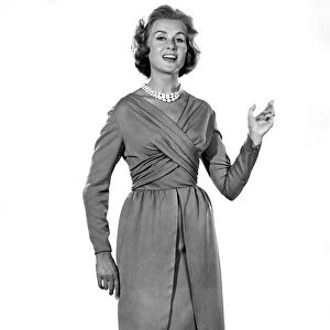 Reveille Fashions: Rosemary Steward modelling the latest 1959 design cocktail dress