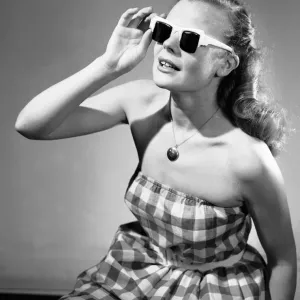 Reveille mannequin seen here modelling the latest summer fashions for 1956 Reveille mannequin seen here modelling the latest summer fashions for 1956
