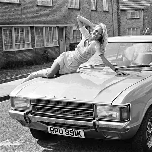 Reveille model Andrea Lloyd seen here posing with a Ford Consul which is top prize in
