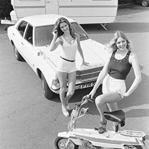 Reveille models seen here posing with a Ford Cortina, a caravan