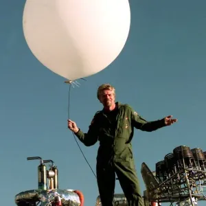 Richard Branson on top of his Balloon capsule December 1997 with a small weather test