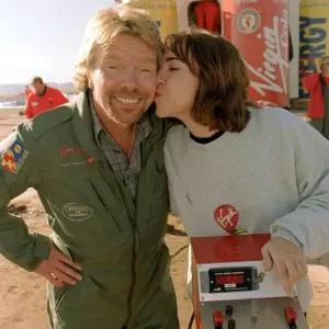Richard Branson is kissed by one of the ground crew Virgin Global Challenger balloon