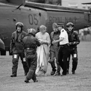 Richard Branson pictured centre walking with the policeman Richard Branson pictured centre walking with the policeman