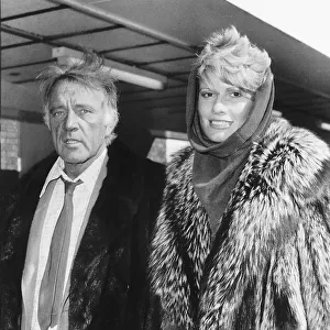 Richard Burton with and his wife Susie Hunt flew in to Heathrow Airport en route to