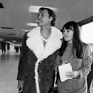 Richard Harris Irish actor at Heathrow airport 1970 with arm around female
