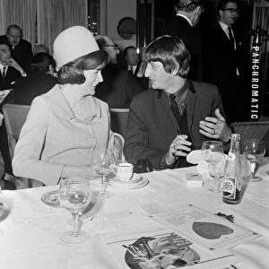 Ringo Starr chats with smiling stage star Maggie Smith during the Variety Club Luncheon