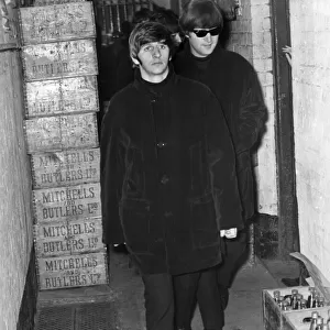 Ringo Starr and John Lennon of the Beatles walking from Stephenson Place through
