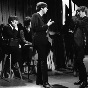 Ringo Starr taking pictures of Paul McCartney smoking in New York during the first