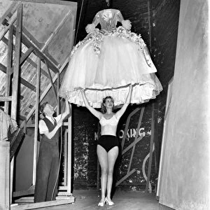 Rita Keane, Show girl has her dress lowered over her. September 1953 D5809