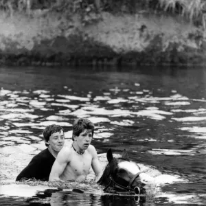 Into the River Eden for a wash for this horse and two bareback riders at the Appleby Into the River Eden for a wash for this horse and two bareback riders at the Appleby