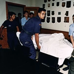 Robert Maxwells body being carried on a stretcher