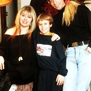 Robin Gibb of the Bee Gees pop group at home with his wife and son