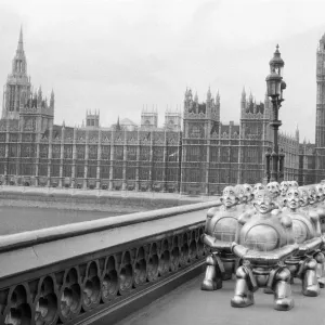 Robots lined up over Westminster Bridge. The robots were supplied by EMI Records who used Robots lined up over Westminster Bridge. The robots were supplied by EMI Records who used