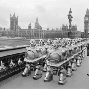 Robots lined up over Westminster Bridge. The robots were supplied by EMI Records who used Robots lined up over Westminster Bridge. The robots were supplied by EMI Records who used