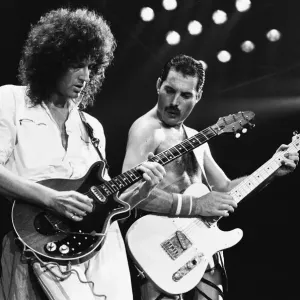 Rock group Queen in concert at Wembley Arena. Lead singer Freddie Mercury Rock group Queen in concert at Wembley Arena. Lead singer Freddie Mercury