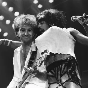 Rock group Queen in concert at Wembley Arena. Lead singer Freddie Mercury Rock group Queen in concert at Wembley Arena. Lead singer Freddie Mercury