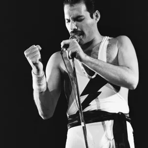 Rock group Queen in concert at Wembley Arena. Lead singer Freddie Mercury Rock group Queen in concert at Wembley Arena. Lead singer Freddie Mercury