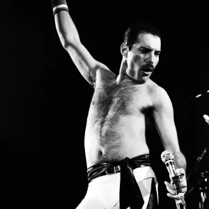 Rock group Queen in concert at Wembley Arena. Lead singer Freddie Mercury Rock group Queen in concert at Wembley Arena. Lead singer Freddie Mercury