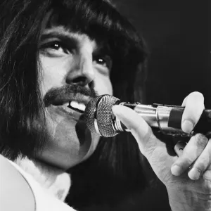 Rock group Queen in concert at Wembley Arena. Lead singer Freddie Mercury Rock group Queen in concert at Wembley Arena. Lead singer Freddie Mercury