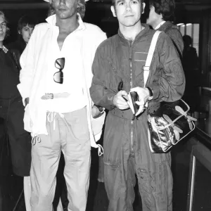 Rod Stewart and Elton John arriving at an airport. February 1978 Rod Stewart and Elton John arriving at an airport. February 1978