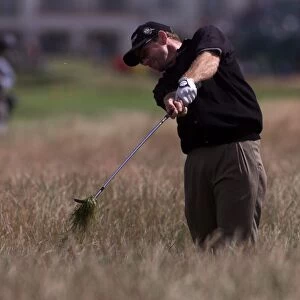 Rodney Pampling plays out of the rough July 1999 on the 17th hole