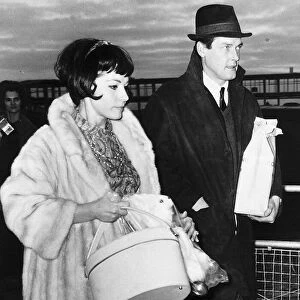 Roger Moore Actor at London Airport with friend Luisa Mattiolli