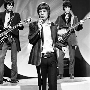 The Rolling Stones. Keith Richards, Mick Jagger and Bill Wyman performing on the Eamonn