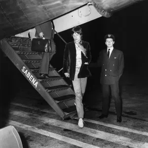 Rolling Stones: Mick Jagger disembarks at Heathrow Airport from his flight home Rolling Stones: Mick Jagger disembarks at Heathrow Airport from his flight home