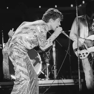 The Rolling Stones. Mick Jagger sings on stage with the Stones during a concert The Rolling Stones. Mick Jagger sings on stage with the Stones during a concert