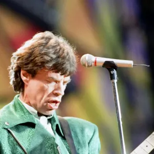 The Rolling Stones performing at Wembley Stadium with lead singer Mick Jagger on stage The Rolling Stones performing at Wembley Stadium with lead singer Mick Jagger on stage