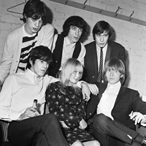 The Rolling Stones pop group with 14 year old fan Christine Hart of Wigan following their