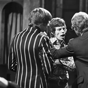 Rolling Stones singer Mick Jagger talking to his manager Andrew Oldham after refusing to