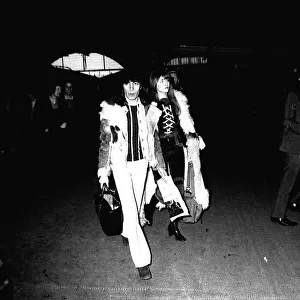 Rolling Stones: Bill Wyman & his girlfriend Astrid arrive at Newcastle Central Station