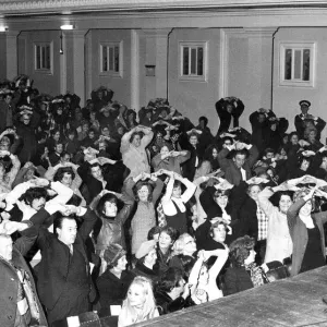 Print of Romark the hypnotist on stage at City Hall, Newcastle in 1971