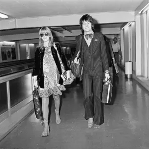 Ronnie Wood and Krissy at Heathrow Airport Print, January 1976