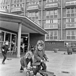Rose Anne Kelly rides the trike with her sister Christina pushing during break time Rose Anne Kelly rides the trike with her sister Christina pushing during break time