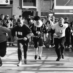 The Row and Flea Market Pancake Race around the stalls of the market in Birmingham City The Row and Flea Market Pancake Race around the stalls of the market in Birmingham City