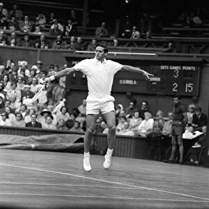Roy Emerson in action on the centre court at Wimbledon