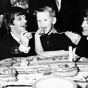 Roy Orbison s, son Roy Jr. being fed cake by John Lennon and Ringo Starr