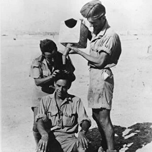 Royal Air Force (RAF) man getting a hair shampoo in Malta