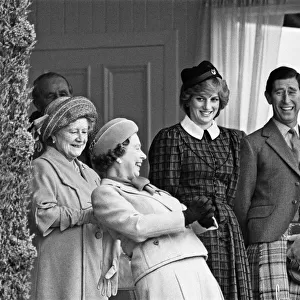 The Royal family share a joke with Geoff Capes as they attend the Braemar Highland Games