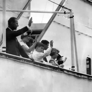 The Royal family visit wales. The Royal party waves to the crowds as they sail