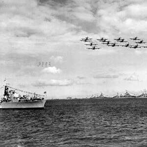 Royal Navy Fairey Firefly aircraft passing over the fleet during the fly past at Spithead