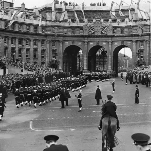 Royal Navy guard contingent make their way up The Mall passing under Admiralty Arch to Royal Navy guard contingent make their way up The Mall passing under Admiralty Arch to