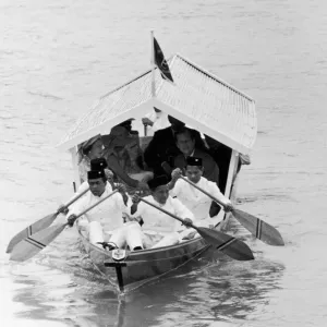 Royal visit to Malaysia. The Queen and The Duke of Edinburgh are transported by boat Royal visit to Malaysia. The Queen and The Duke of Edinburgh are transported by boat